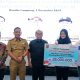 Pj. Gubernur Lampung Samsudin menyerahkan Tali Asih bagi Atlet, Pelatih dan Official berprestasi Marching Band VIP Federasi Youth Band Indonesia (FYBI) Lampung || Foto: Adpim Pemprov Lampung