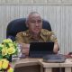 Pemprov Lampung diwakili Staf Ahli Bidang Ekonomi, Keuangan dan Pembangunan (Ekubang), Zainal Abidin mengikuti Rapat Koordinasi Pengendalian Inflasi Daerah dirangkaikan dengan Sosialisasi Surat Edaran Menteri Pariwisata RI (secara virtual || Foto: Dinas Kominfotik Provinsi Lampung
